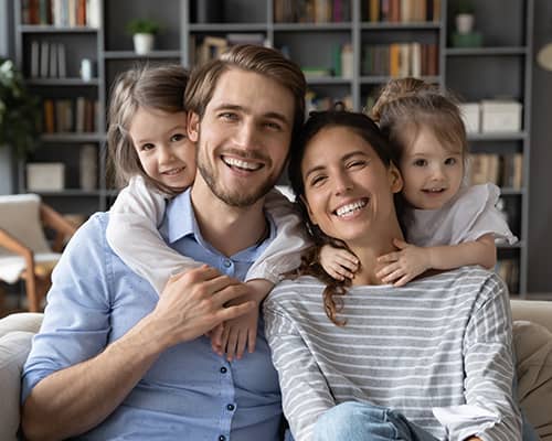 Happy Family Sitting Together After Home Purchase in New Hampshire